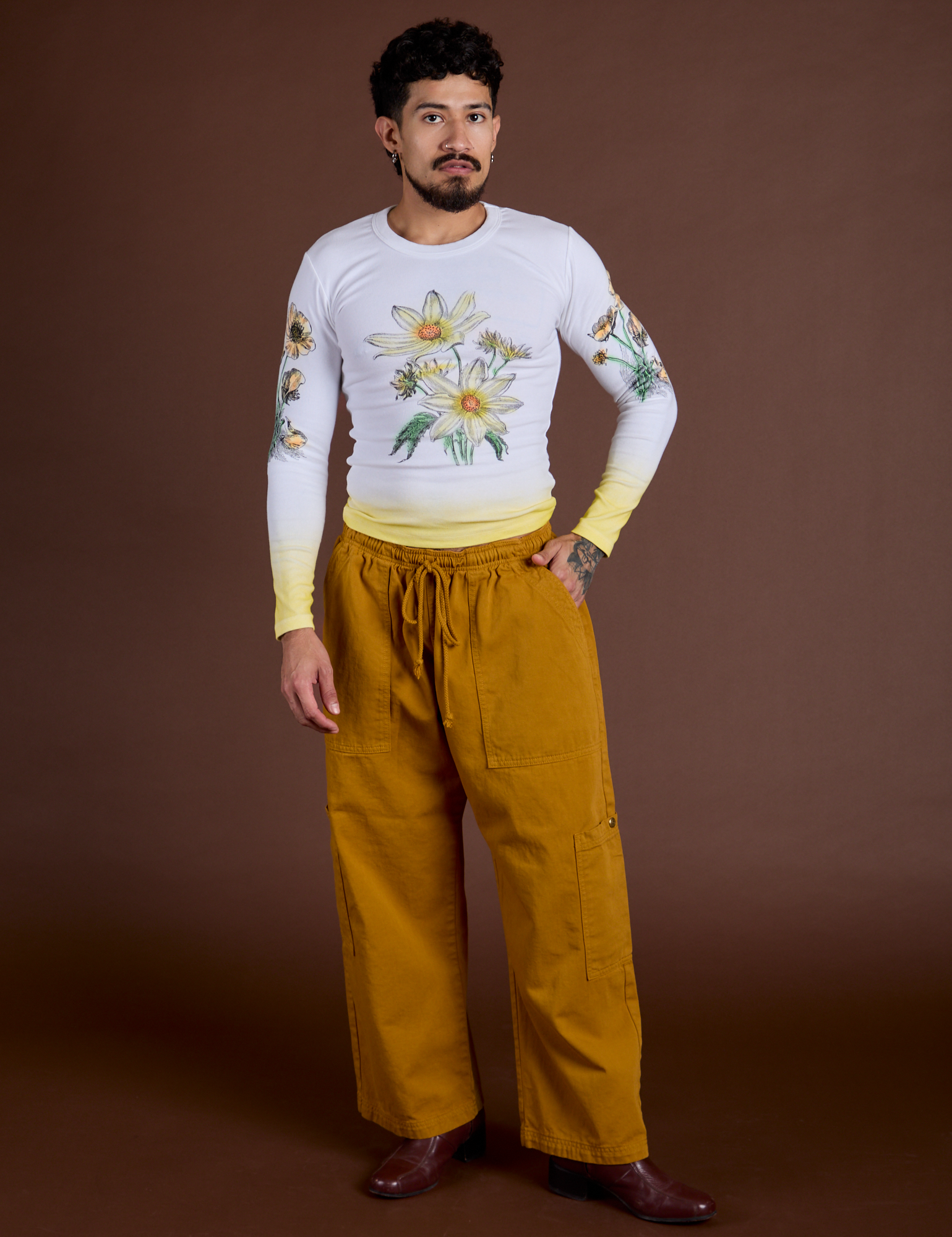 Jesse is wearing Floral Long Sleeve Baby Tee in Yellow and spicy mustard Drop Pocket Cargo Pants