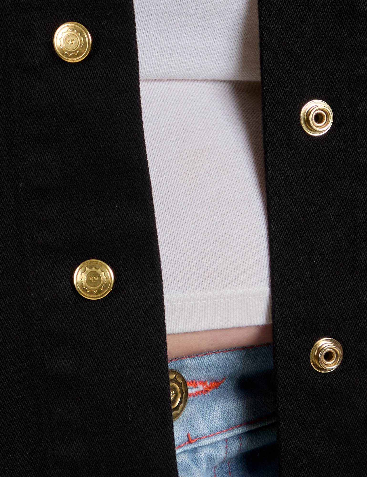 Close up of sun baby brass button snaps on Work Jacket in Basic Black