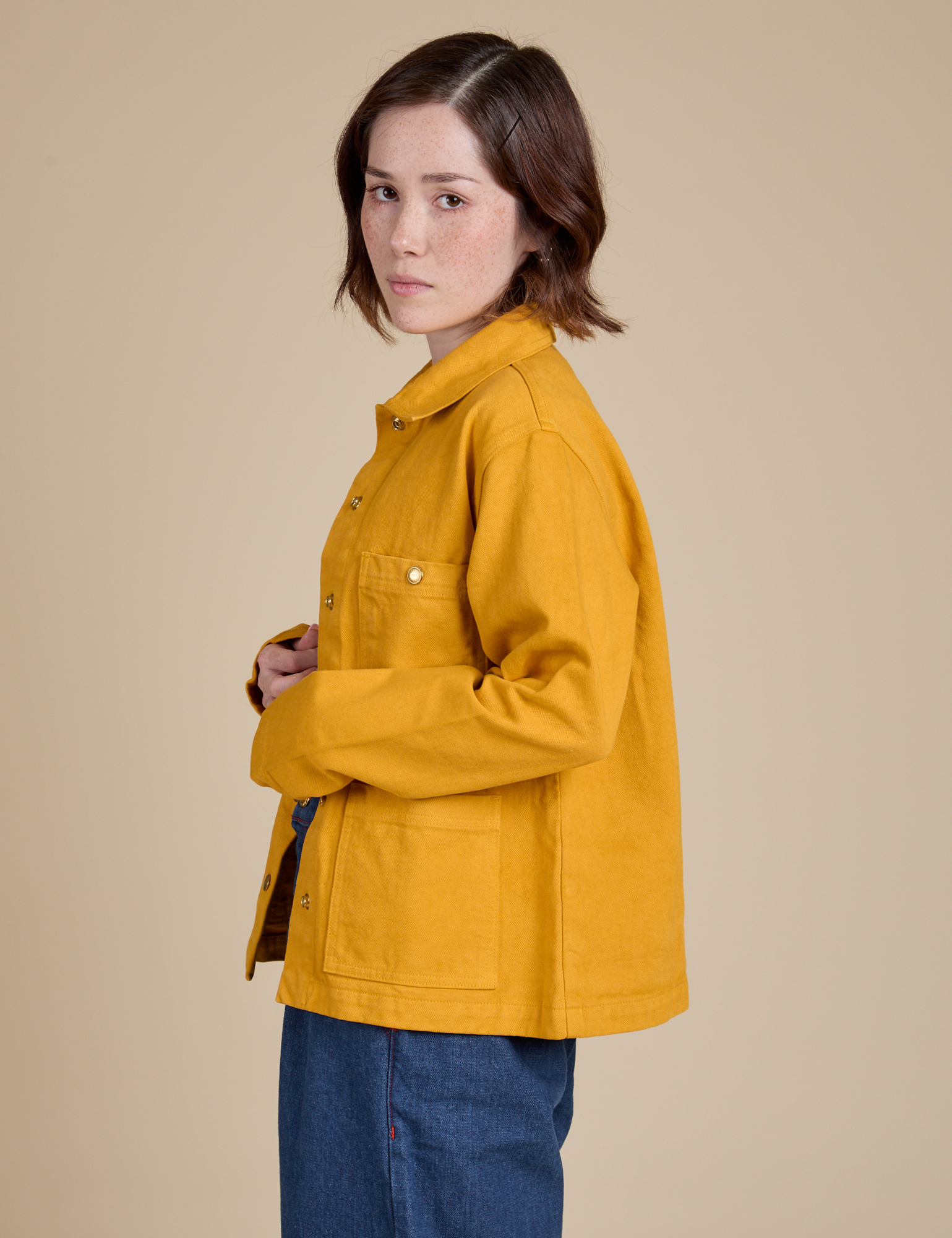 Side view of Denim Work Jacket in Mustard Yellow on Hana