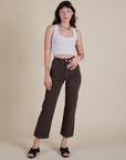 Alex is 5’8” and wearing XS Work Pants in Espresso Brown paired with vintage tee white Cropped Tank