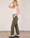 Side view of Work Pants in Surplus Green and Cropped Tank in vintage tee off-white on Margaret