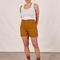Tiara is wearing Classic Work Shorts in Spicy Mustard and vintage off-white Tank Top