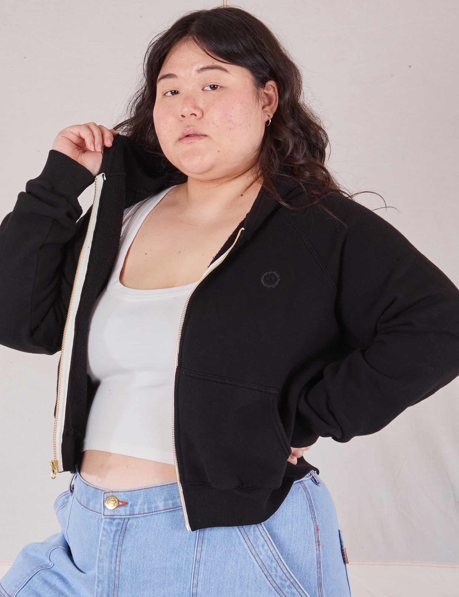 Cropped Zip Hoodie in Basic Black angled front view on Ashley