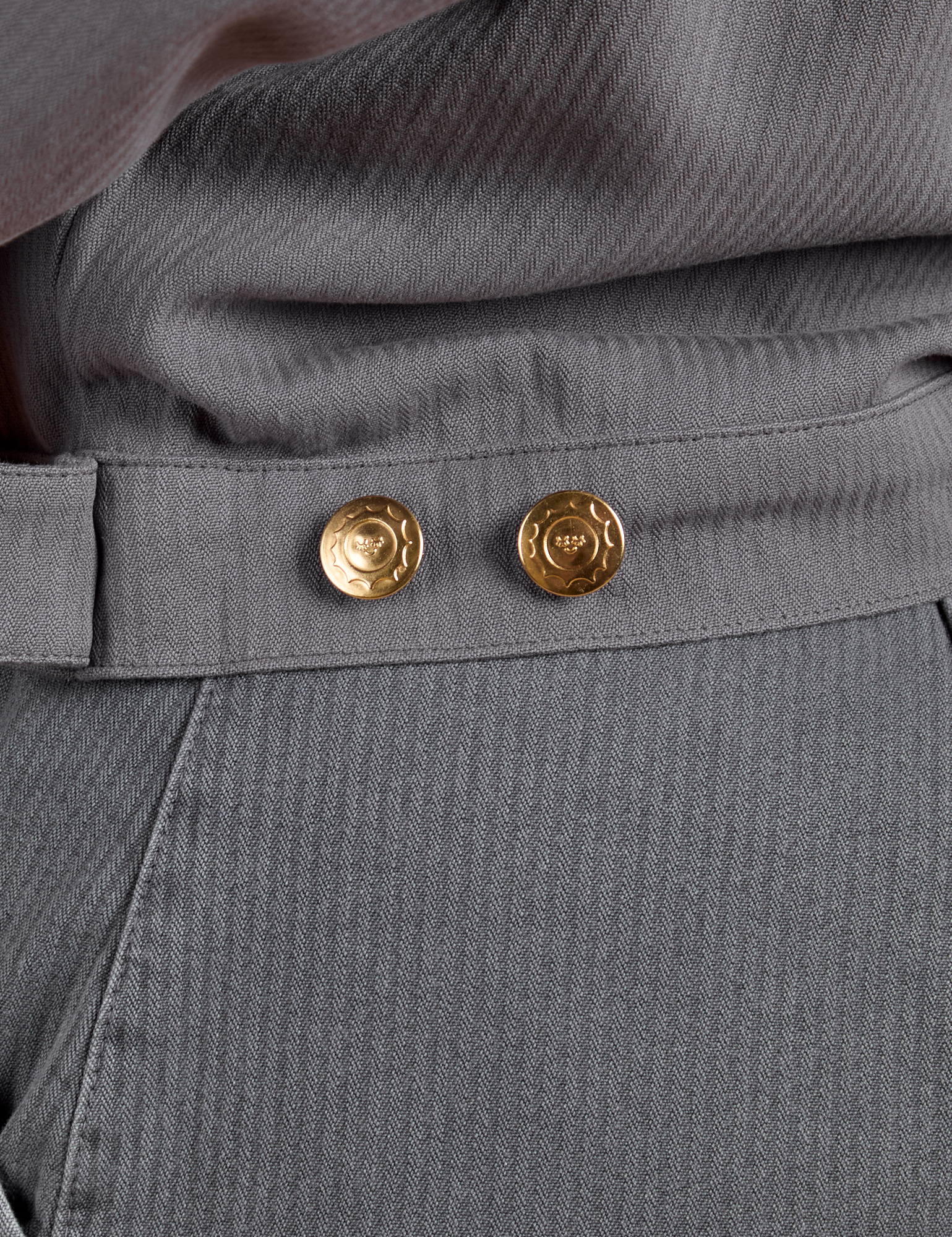 Close up of brass buttons on Heritage Mechanic Jacket in Washed Grey