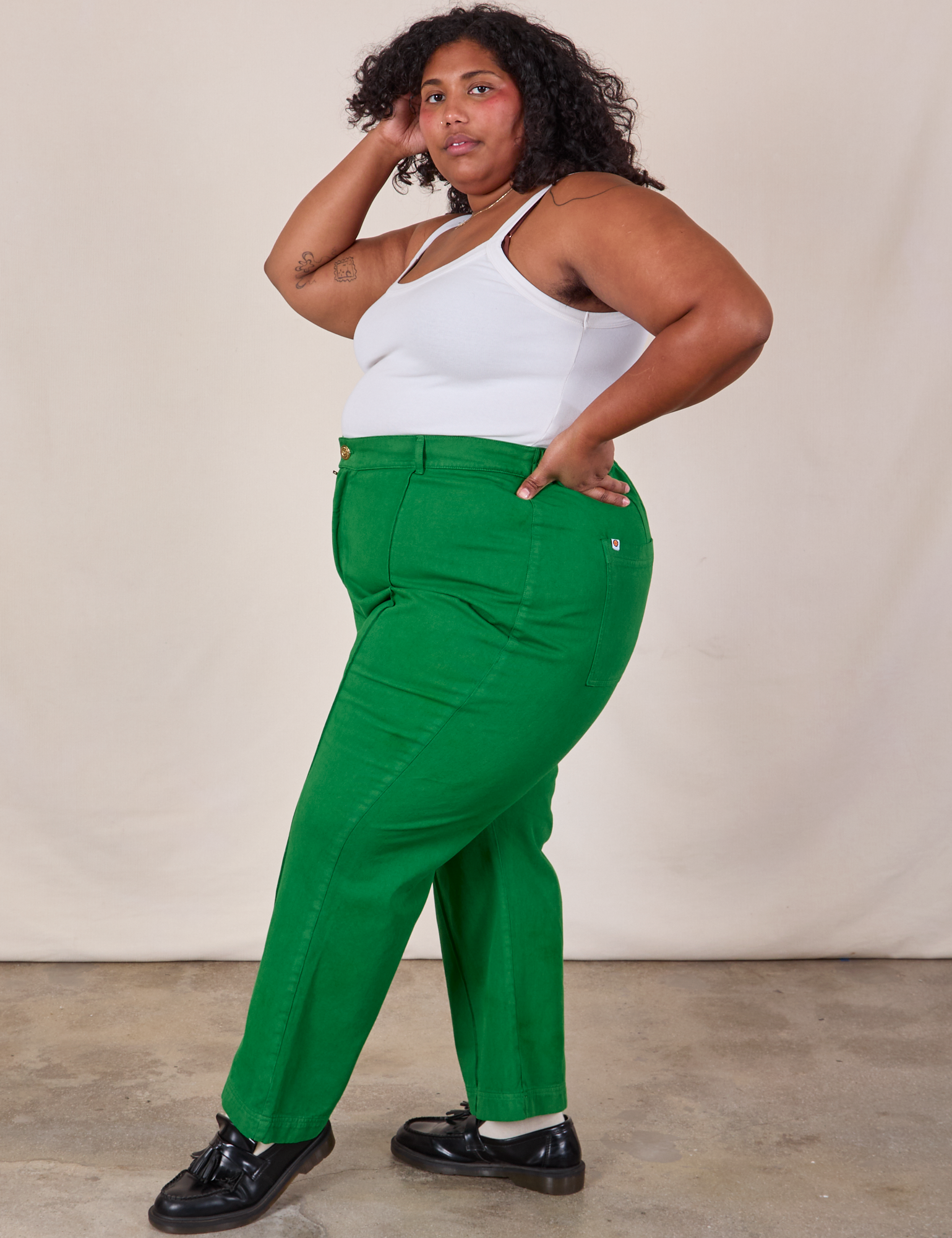 Side view of Western Pants in Forest Green and Cropped Cami in Vintage Tee Off-White on Morgan