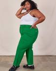 Side view of Western Pants in Forest Green and Cropped Cami in Vintage Tee Off-White on Morgan