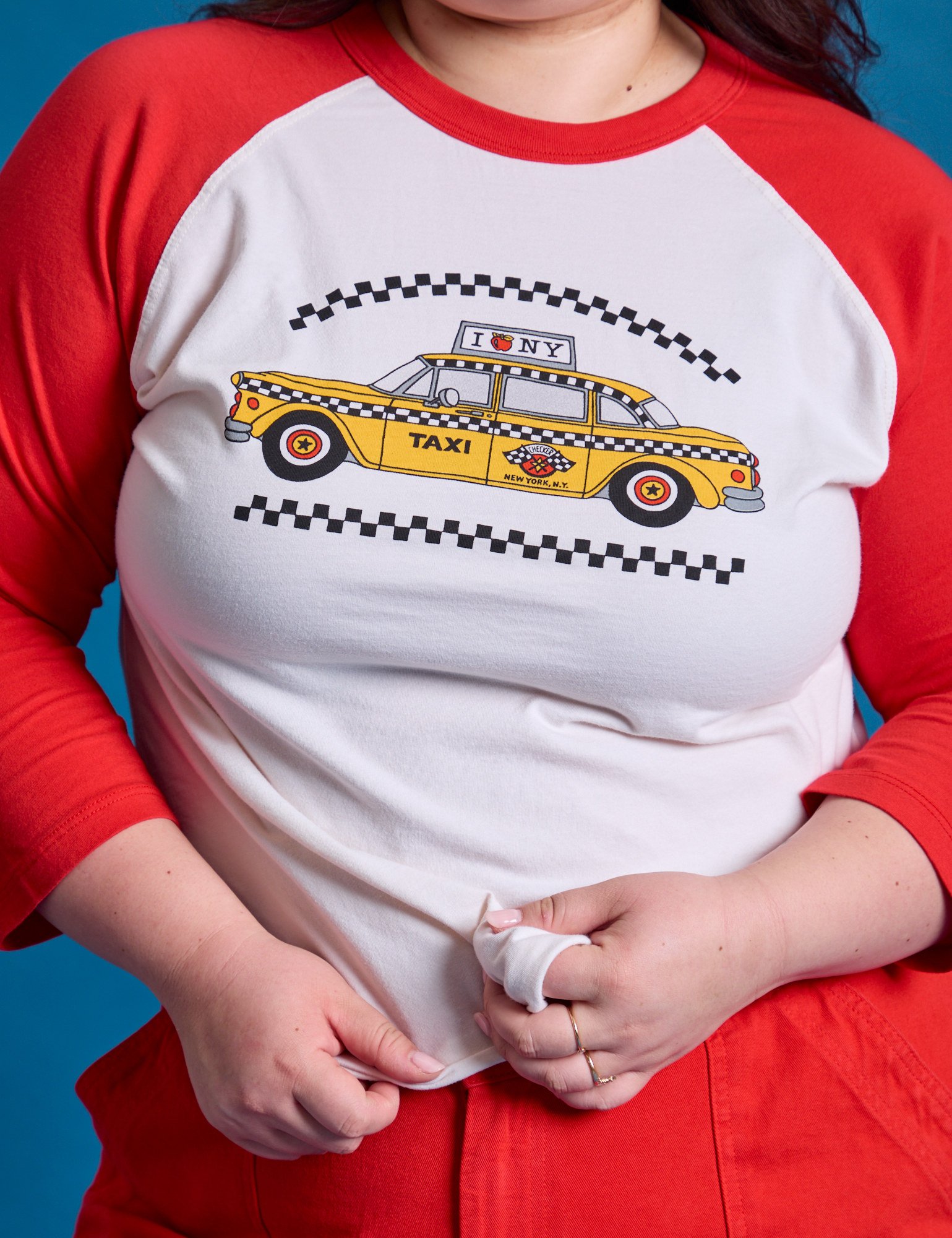 Taxi Raglan Tee in NYC front close up on Ashley