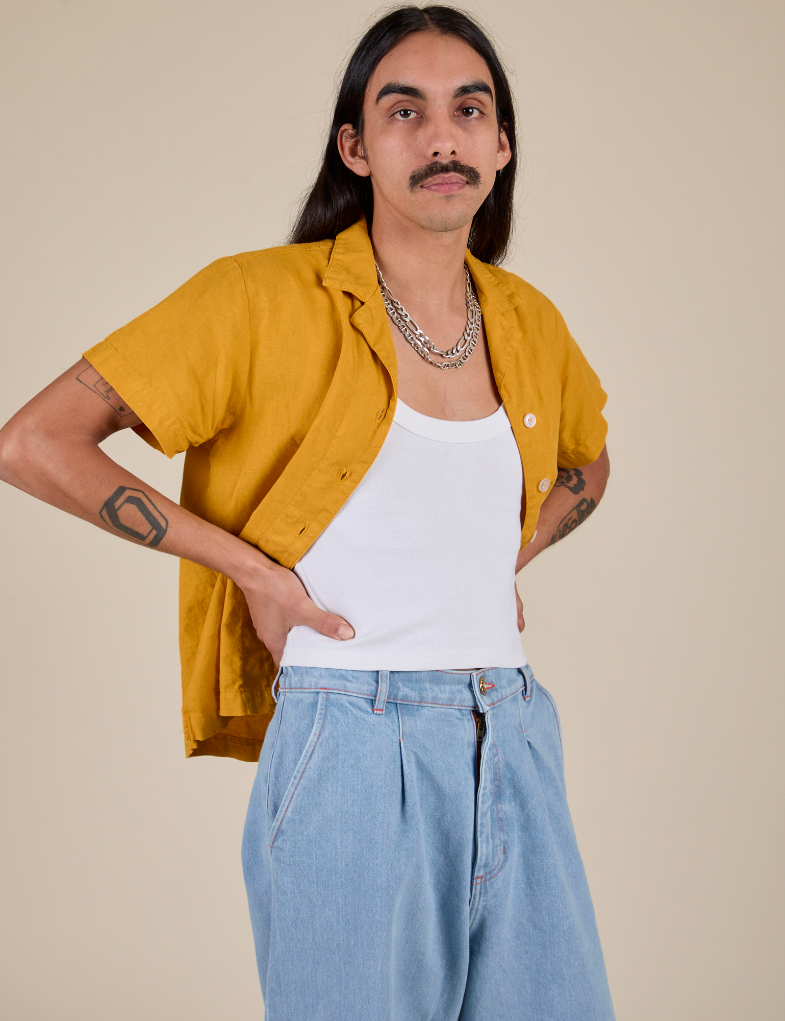 Angled front view of Pantry Button-Up in Mustard Yellow on Anthony