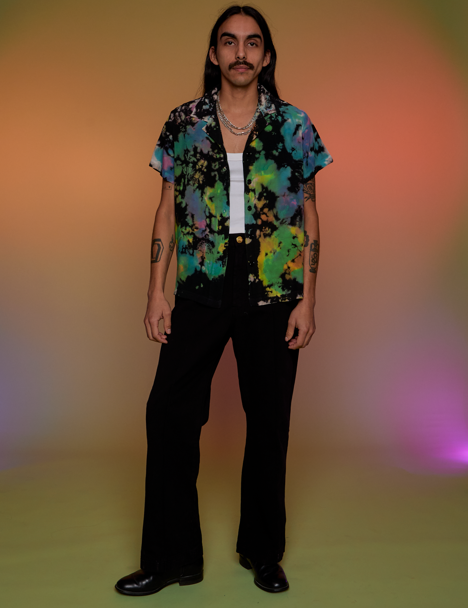 Anthony is wearing Pantry Button-Up in Rainbow Magic Waters