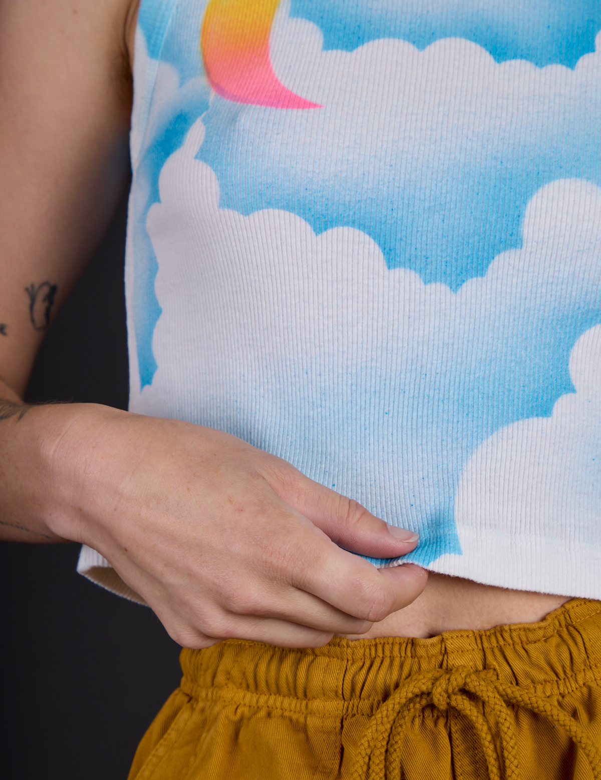 Hem close up of the Morning Moon Airbrush Muscle Tee on Alex