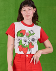Alex is wearing Anniversary Tee in Strawbaby tucked into mustang red Work Pants