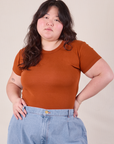 Ashley is 5'7" and wearing L Baby Tee in Burnt Terracotta