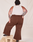 Back view of Bell Bottoms in Fudgesicle Brown and vintage off-white Cropped Tank Top on Sam