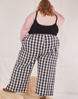 Back view of Wide Leg Trousers in Big Gingham and black Cropped Cami on Catie