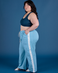 Side view of Painted Drop Pocket Cargo Pants in Baby Blue and lagoon Mini Tank on Ashley