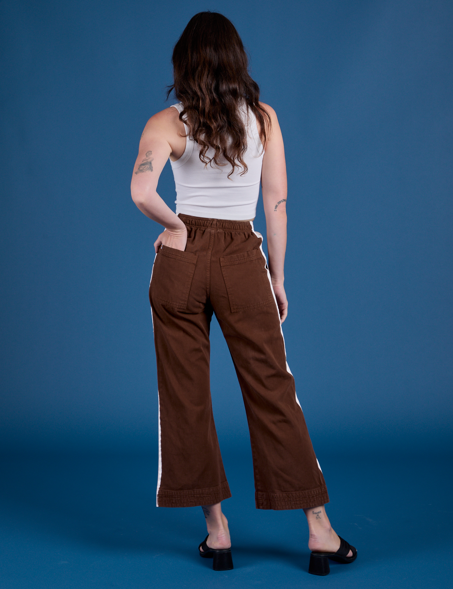 Painted Action Pants in Fudgesicle Brown back view on Alex