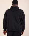 Oversized Hoodie in Basic Black back view on Elijah