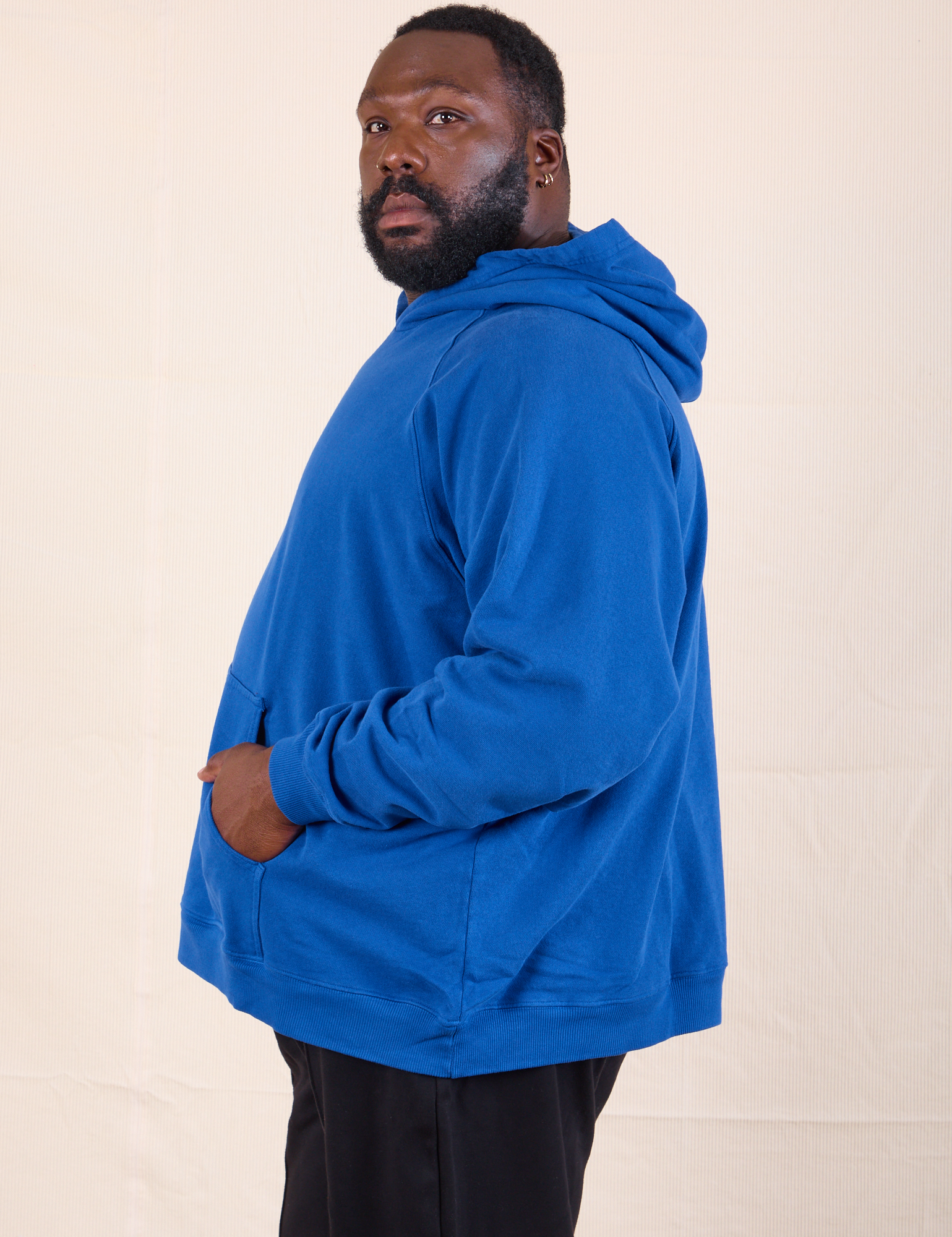 Oversized Hoodie in Royal Blue side view on Elijah