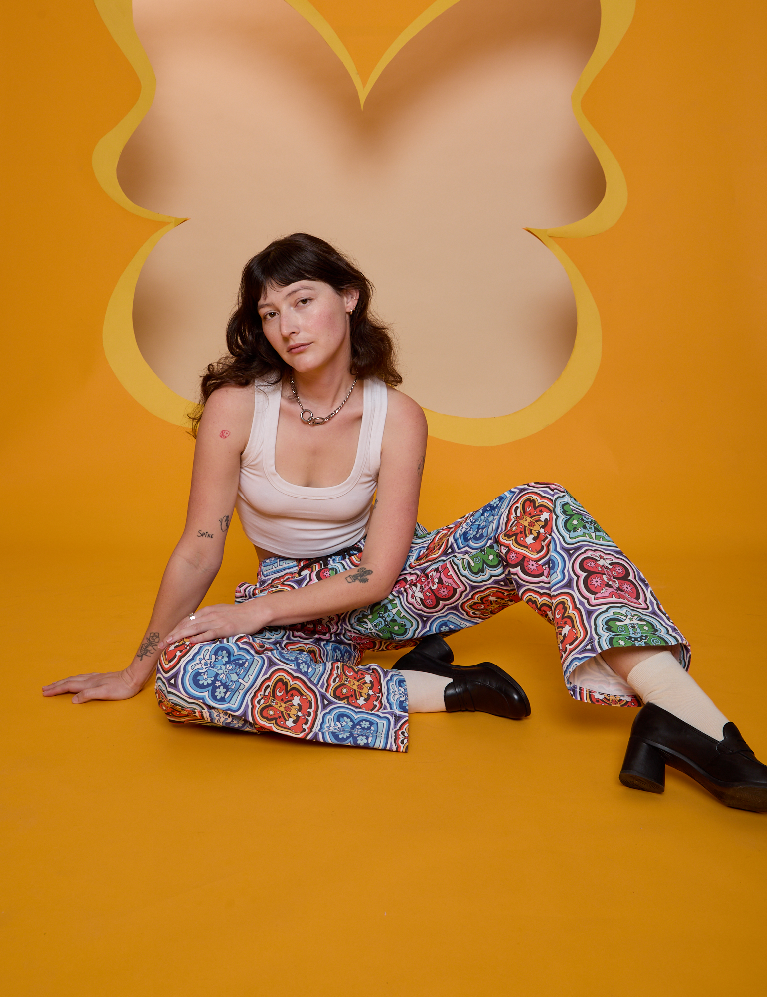 Butterfly Kaleidoscope Drop Pocket Cargo Pants and vintage tee white Cropped Tank worn by Alex