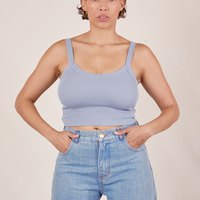 Tiara is 5'4" and wearing XS Cropped Cami in Periwinkle paired with light wash Sailor Jeans