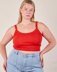 Lish is wearing Cropped Cami in Mustang Red and light wash Carpenter Jeans