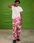 Isaac is 5'10" and wearing M Cherry Paintstamped Work Pants in Bubblegum Pink paired with The Organic Vintage Tee in Vintage Off-White