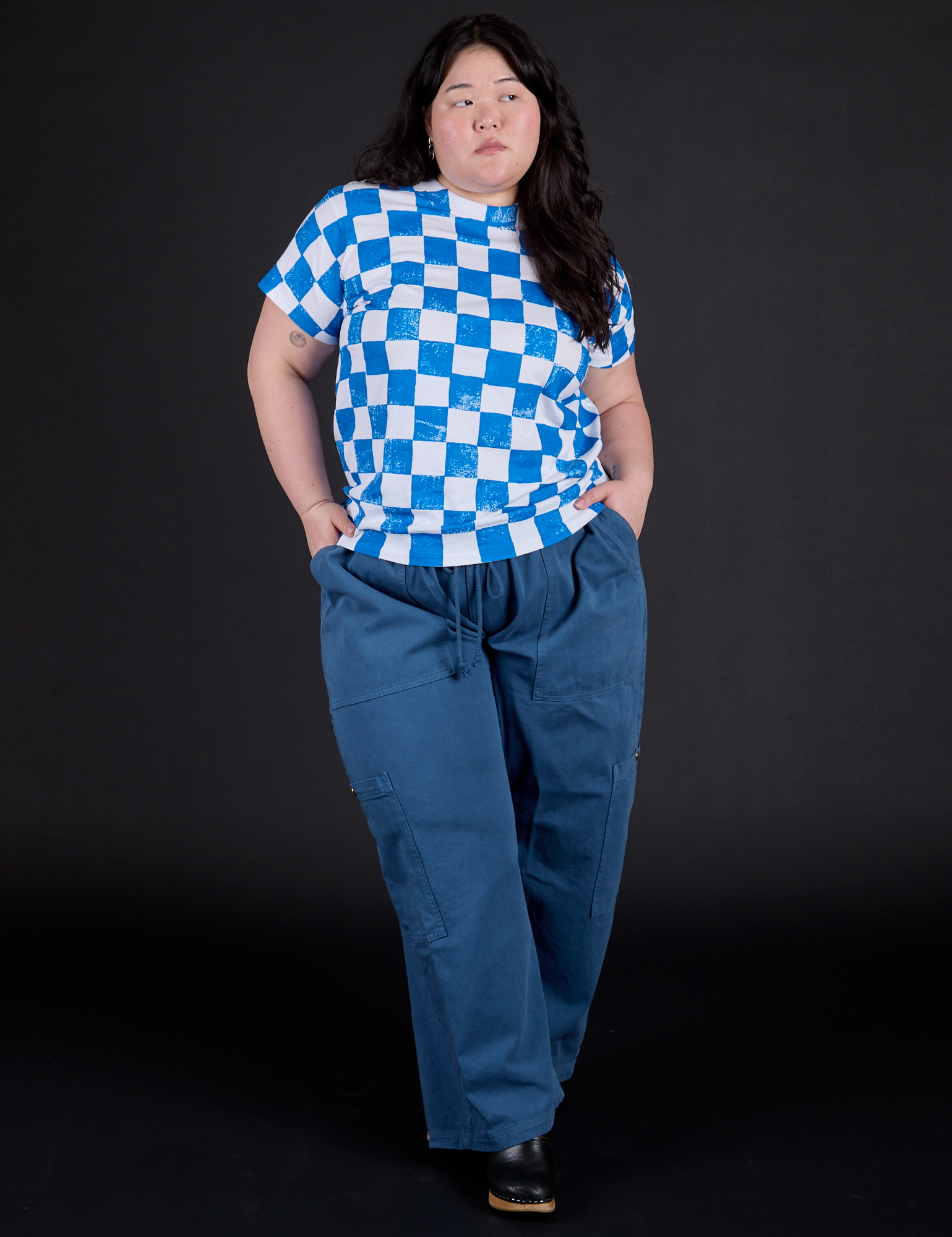 Ashley is wearing Checker Organic Tee in Blue and Drop Pocket Cargo Pants in French Blue