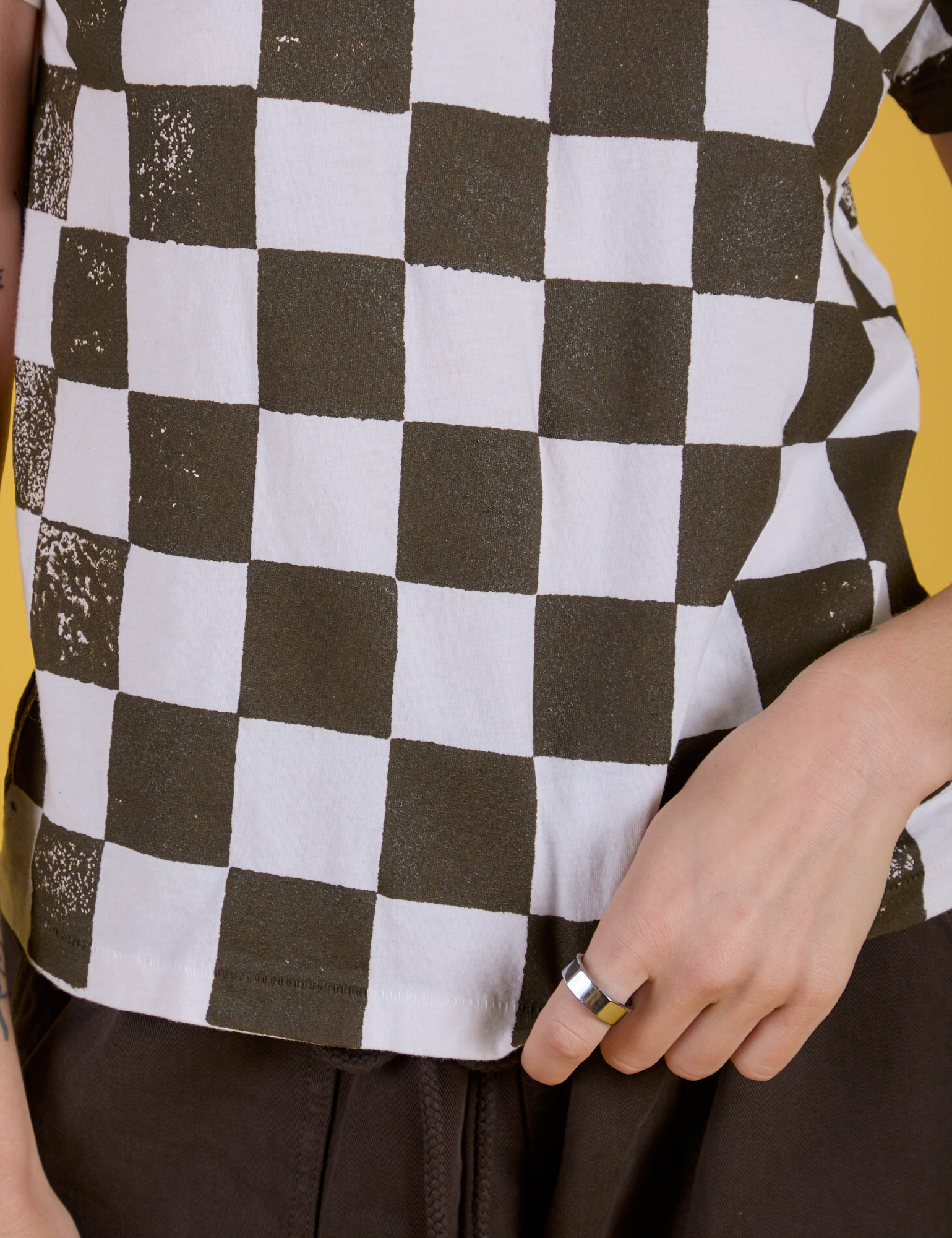 Checker Organic Tee in Espresso Brown close up on Alex