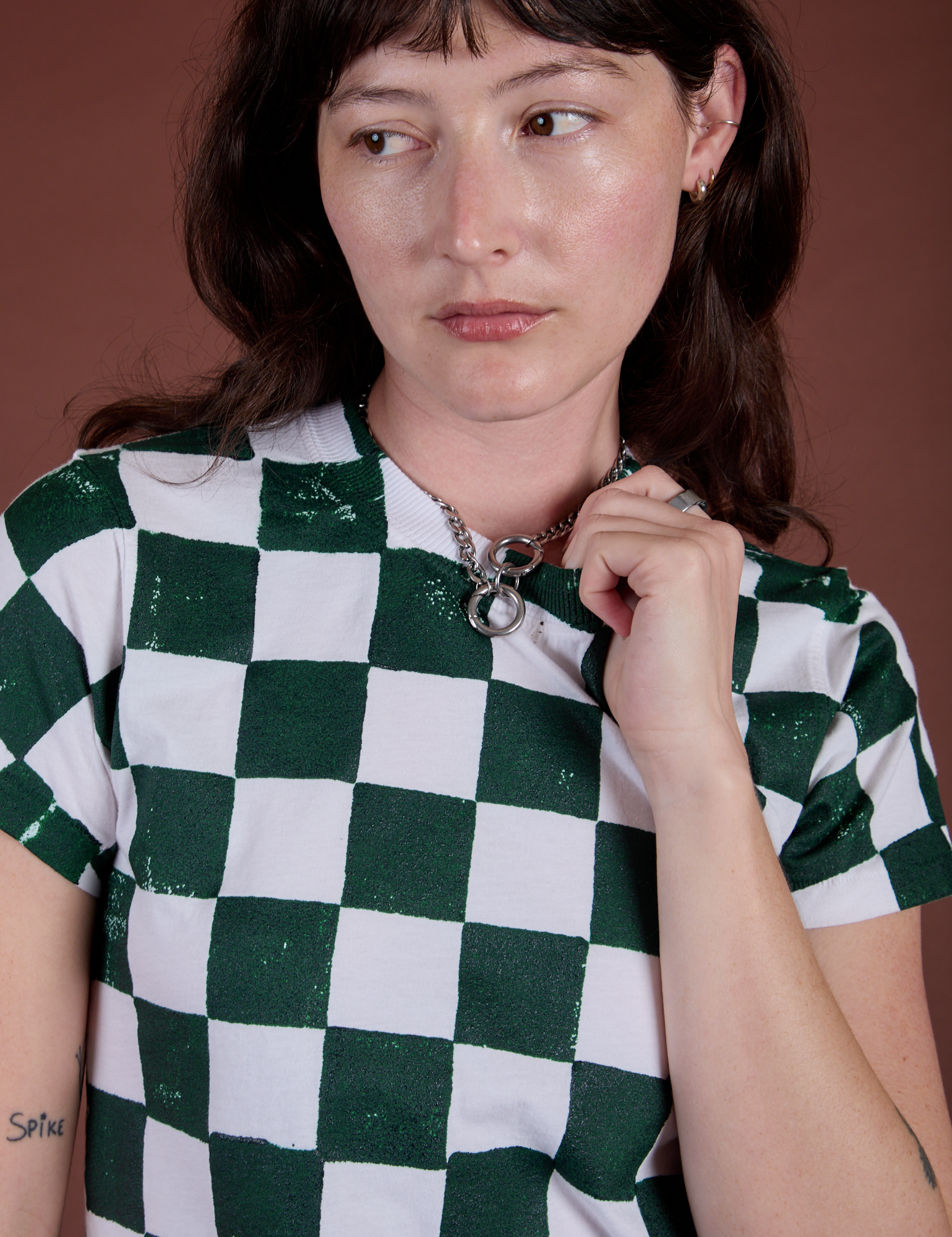 Checker Organic Tee in Swamp Green front close up on Alex