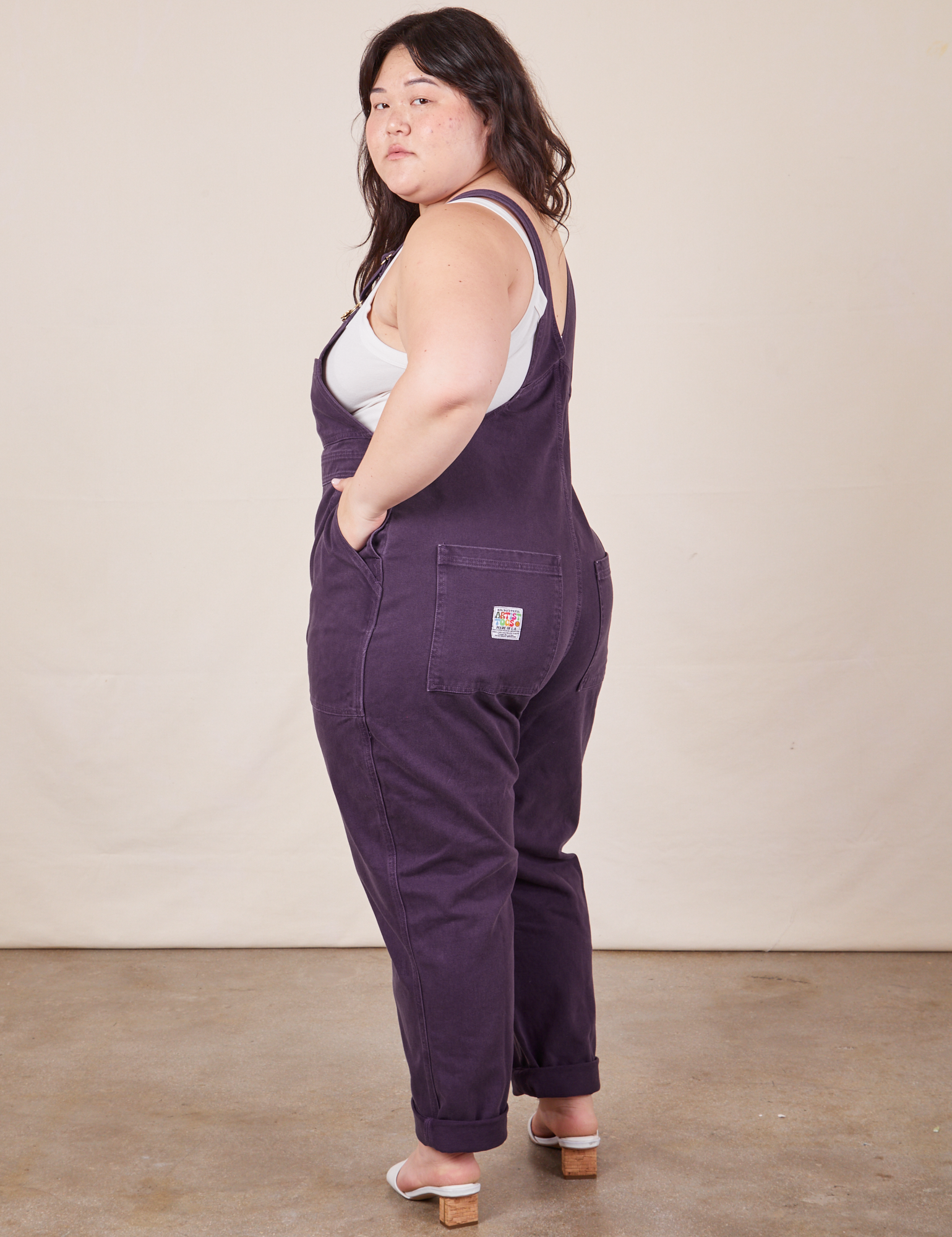 Angled back view of Original Overalls in Mono Nebula Purple worn by Ashley