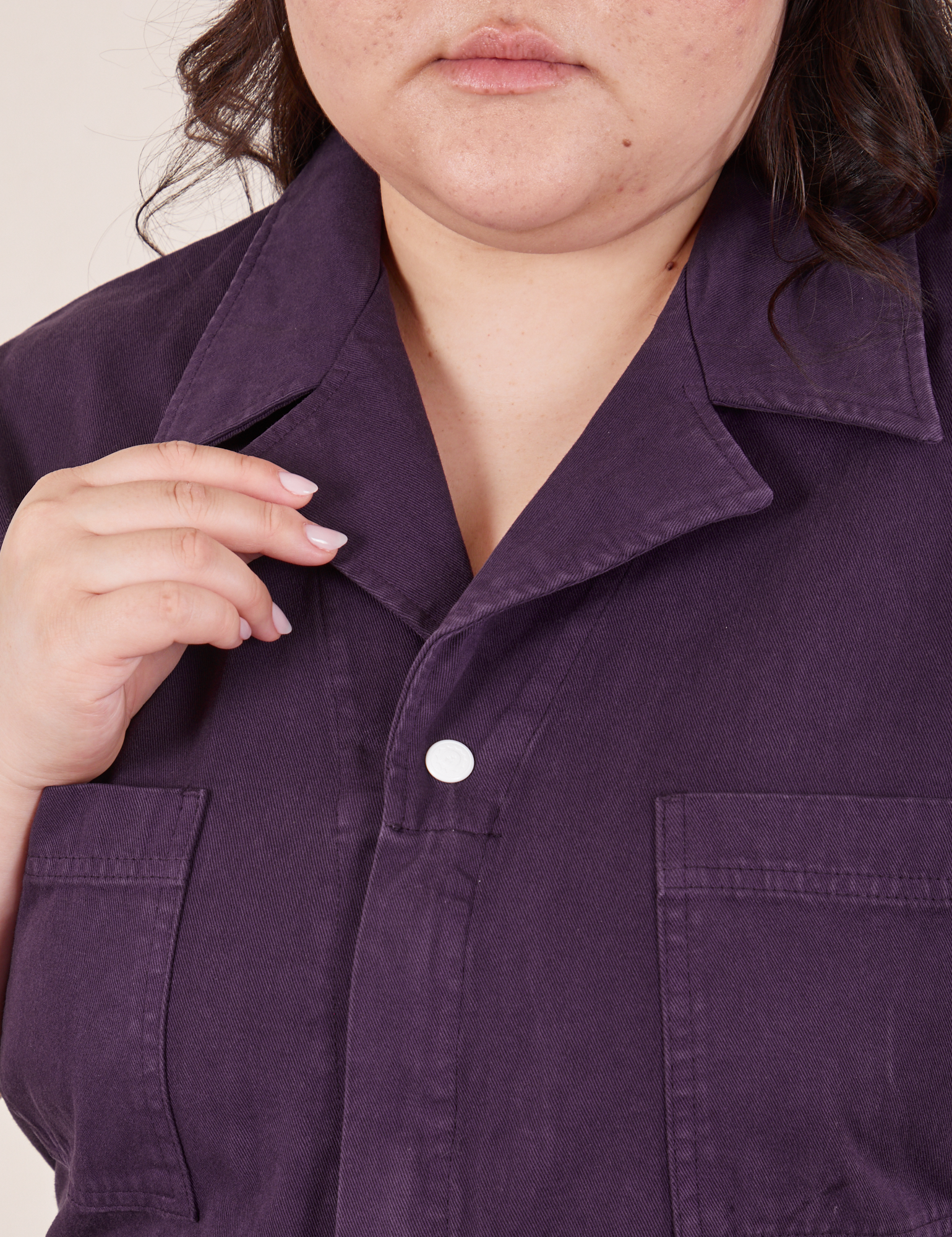 Front close up of Short Sleeve Jumpsuit in Nebula Purple worn by Ashley
