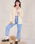 Alex is wearing Corduroy Overshirt in Vintage Off-White with a vintage off-white Cropped Cami underneath and light wash Denim Trouser Jeans