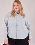 Juliet is wearing a buttoned up Cropped Overshirt in Stone White