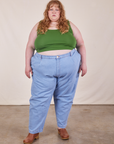 Catie is wearing Cropped Tank Top in Lawn Green and light wash Trouser Jeans