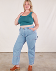 Lish is wearing Cropped Tank Top in Marine Blue and light wash Carpenter Jeans