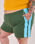 Painted Stripe Easy Shorts in Dark Emerald Green side view close up on Sam