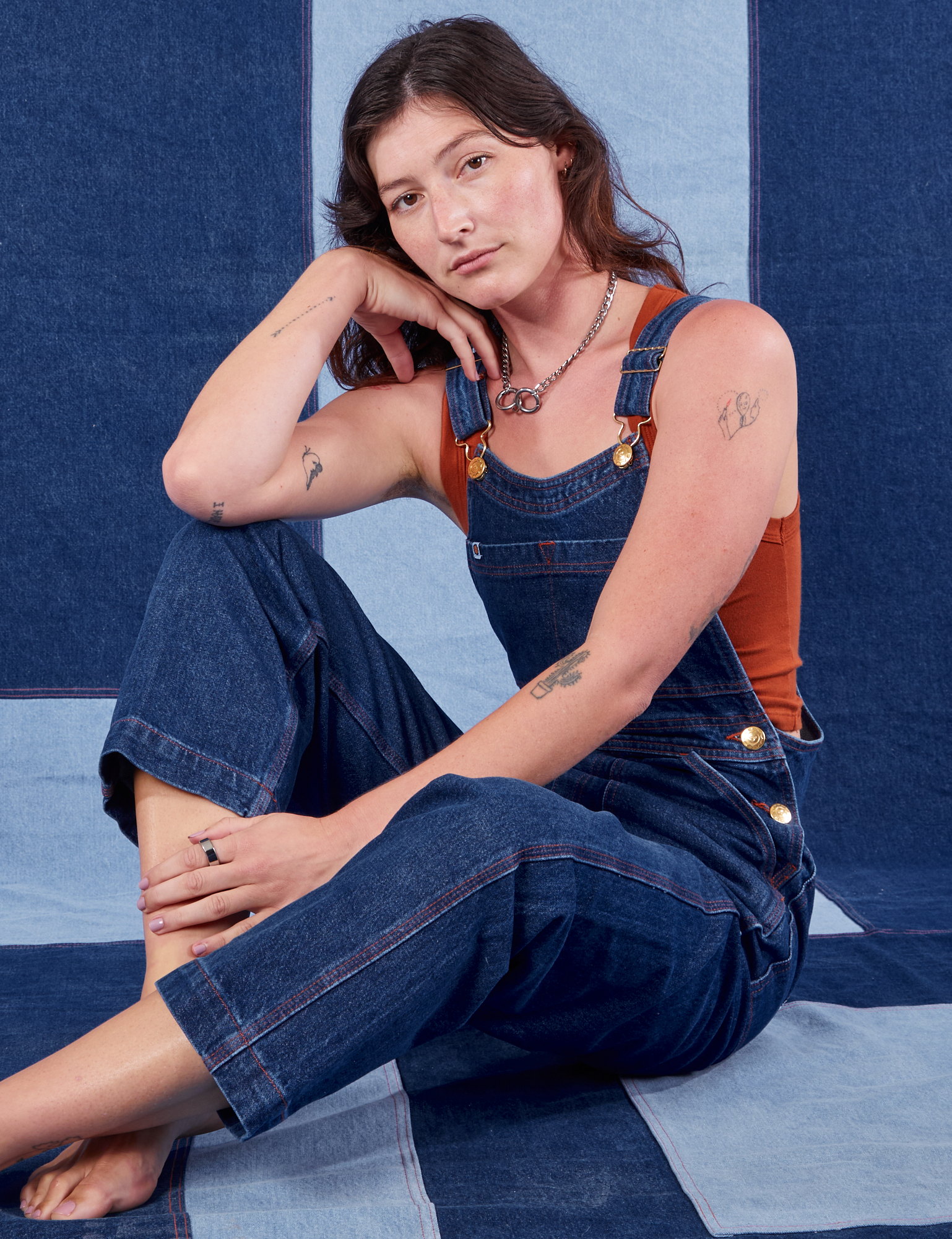 Alex is wearing Indigo Denim Original Overalls in Dark Wash