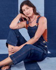 Alex is wearing Indigo Denim Original Overalls in Dark Wash