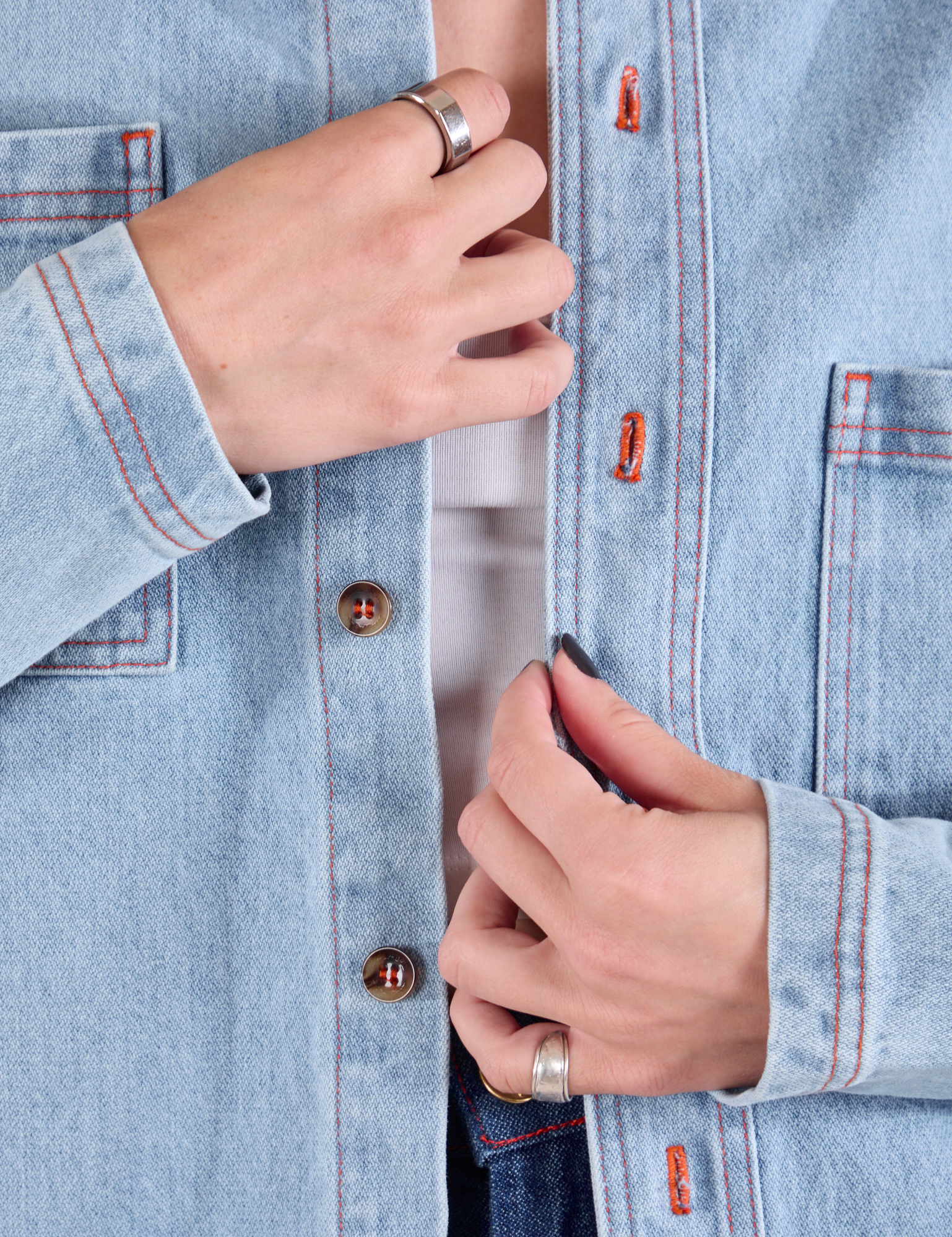 Denim Overshirt in Light Wash close up of button placket on Alex