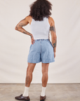 Back view of Denim Trouser Shorts in Light Wash and Cropped Tank in vintage tee off-white on Jesse