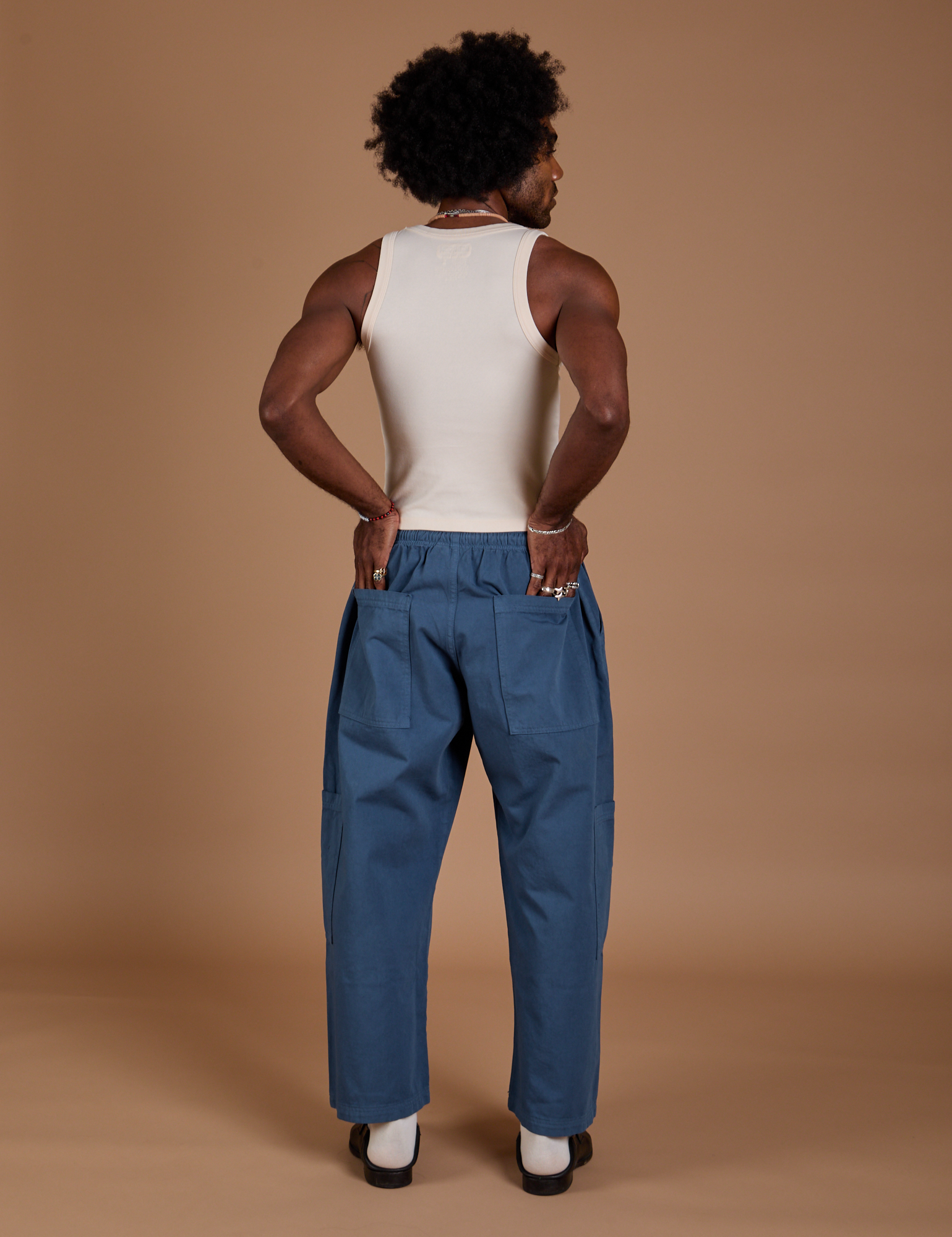 Back view of Drop Pocket Cargo Pants in French Blue and Tank Top in vintage tee white