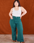 Ashley is 5'7" and wearing 0XL Gingham Western Pants in Green paired with a Cropped Tank in vintage tee off-white