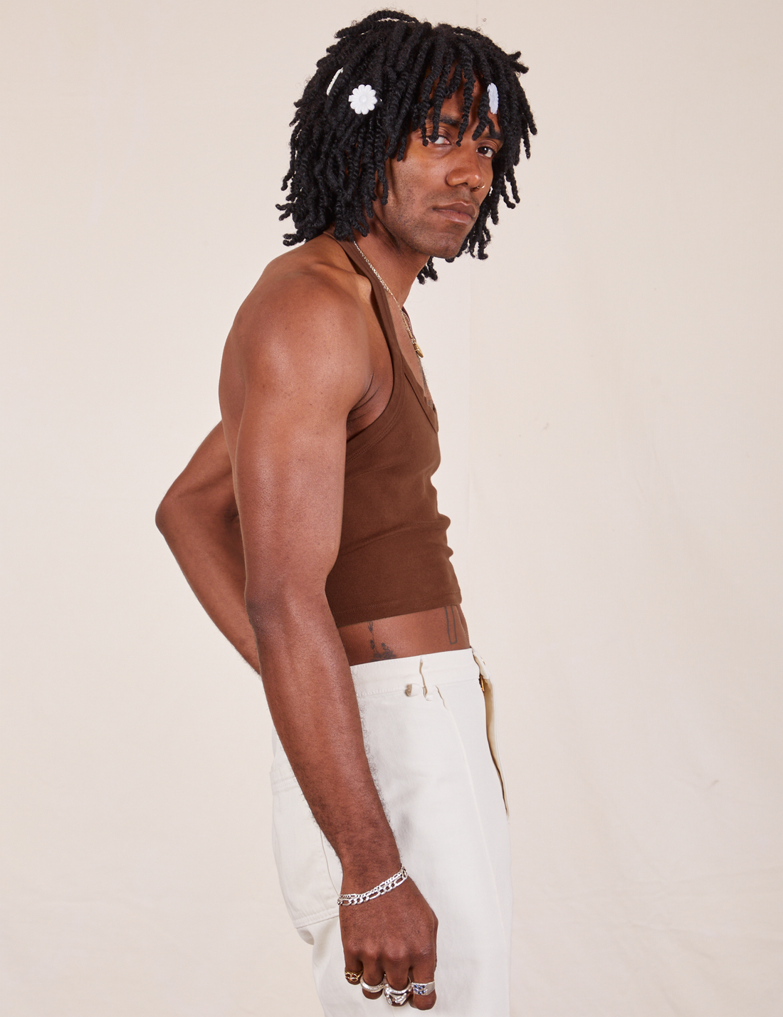 Side view of Halter Top in Fudgesicle Brown and vintage off-white Western Pants worn by Jerrod