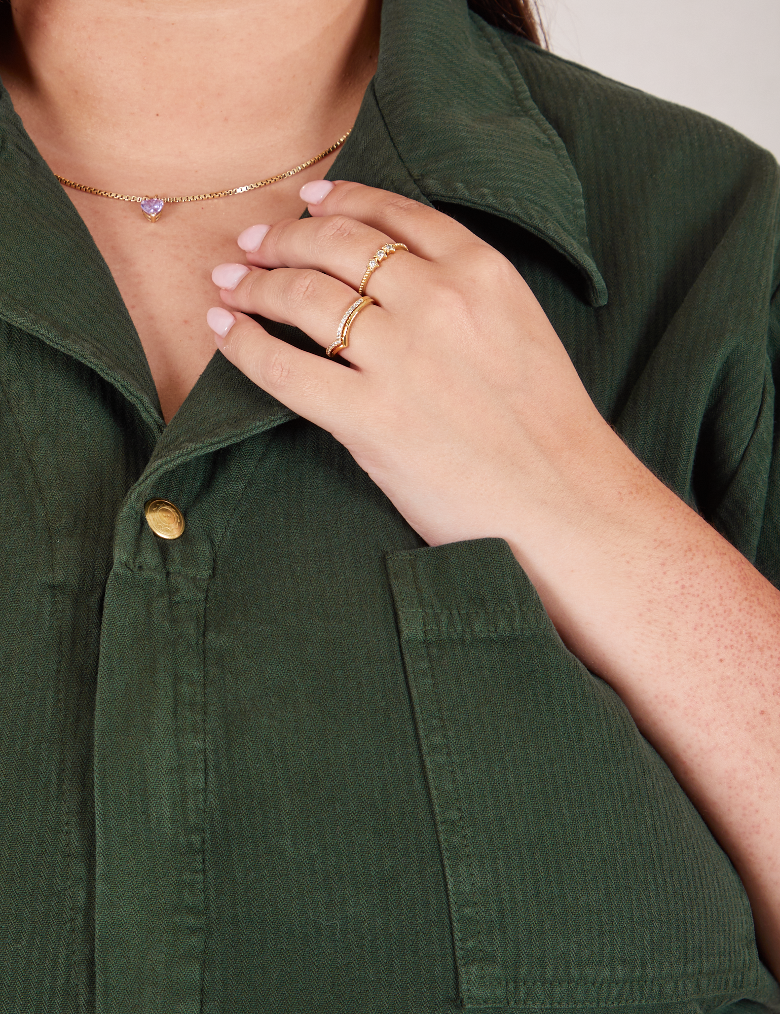 Heritage Short Sleeve Jumpsuit in Swamp Green front collar close up on Katie