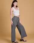 Side view of Heritage Wide Leg Trousers in Washed Grey and Cropped Tank in Vintage Tee White on Alex