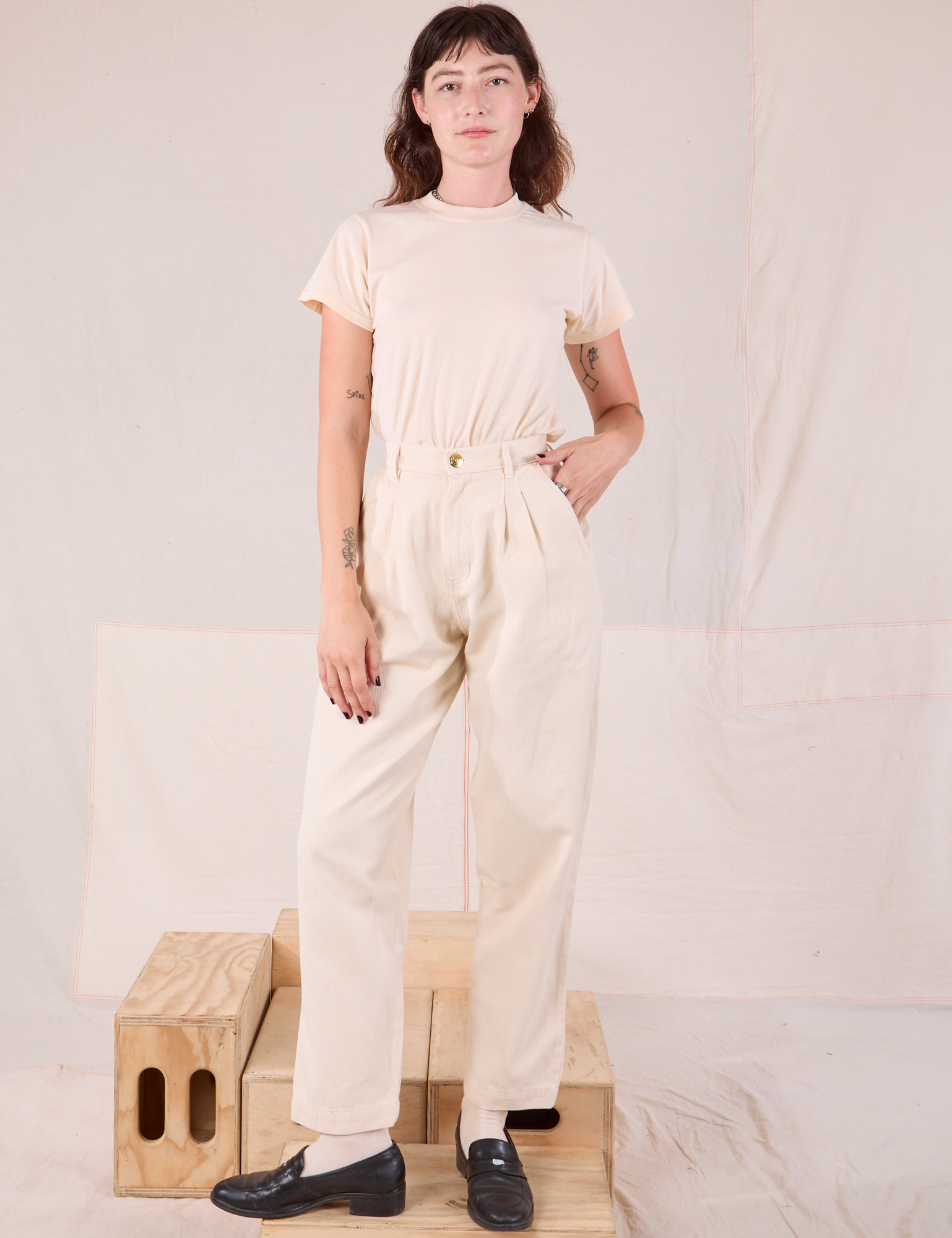 Alex is 5’8” and wearing XXS Heritage Trousers in Natural  paired with Organic Vintage Tee in vintage tee off-white