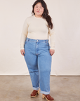 Ashley is wearing Honeycomb Thermal in Vintage Off-White tucked into light wash Frontier Jeans