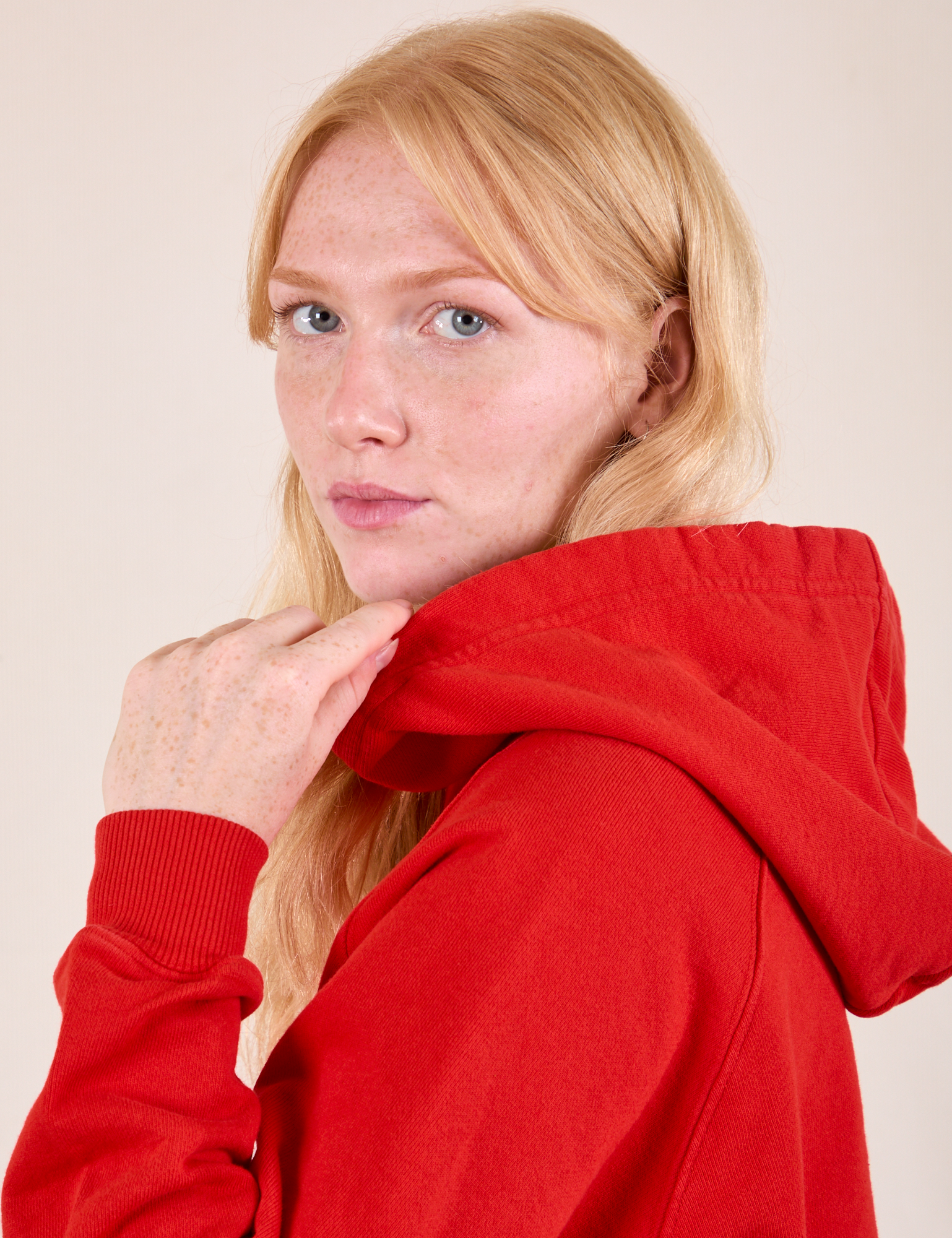 Oversized Hoodie in Mustang Red shoulder side view close up on Margaret