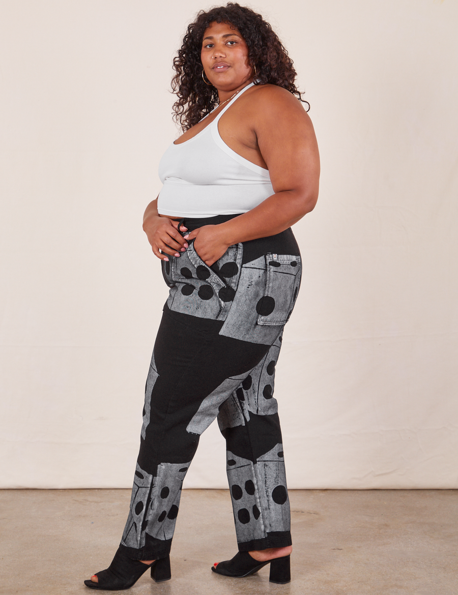 Side view of Icon Work Pants in Dice and vintage off-white Halter Top worn by Morgan