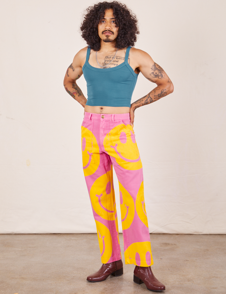 Jesse is wearing Icon Work Pants in Smilies and marine blue Cropped Cami